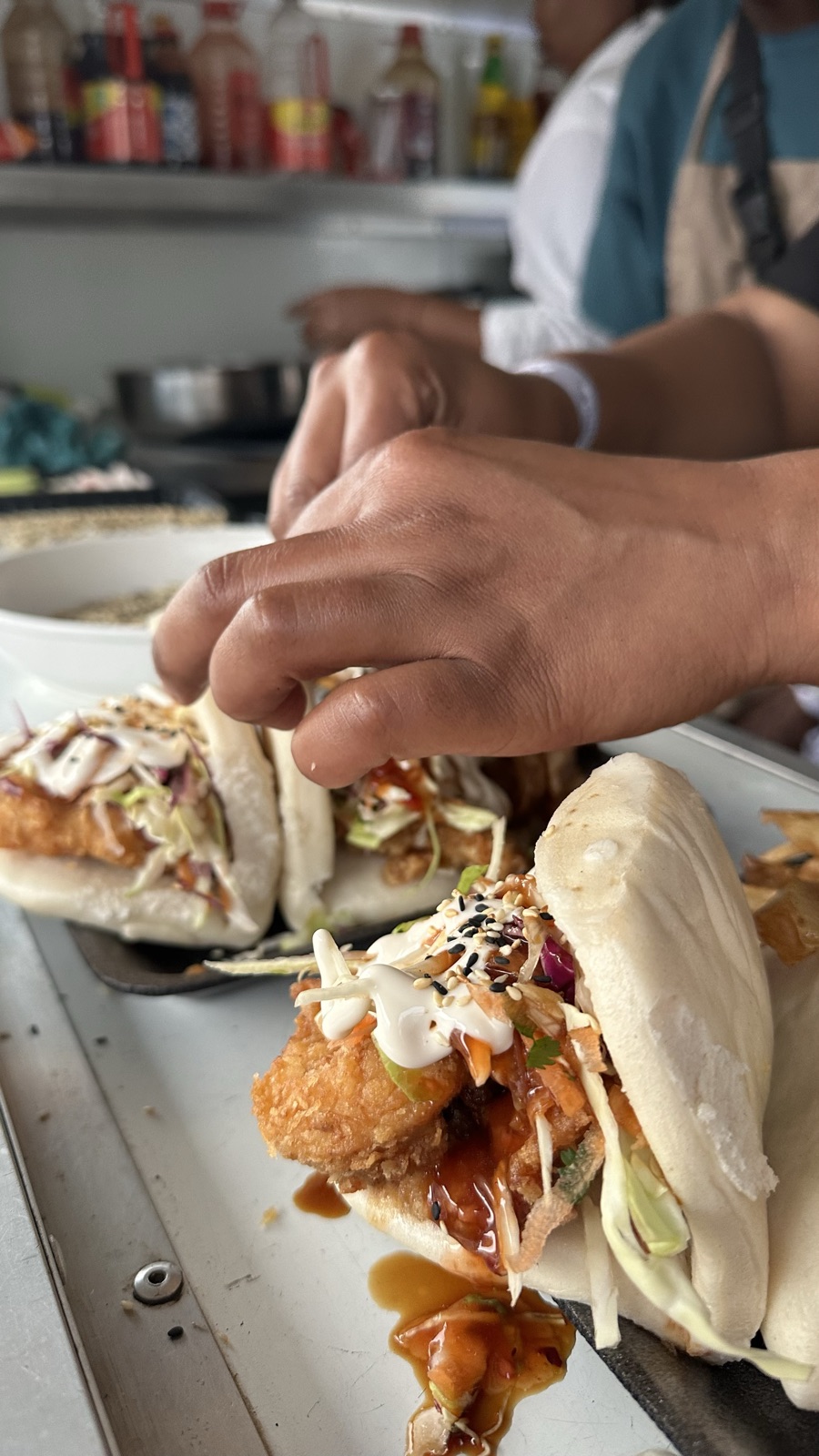 Fresh bao buns being prepared in the trailer